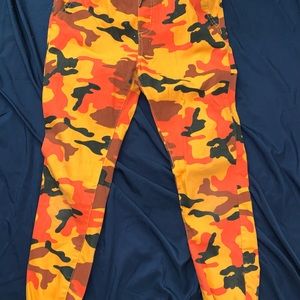 Orange Camouflage design pants. Size M